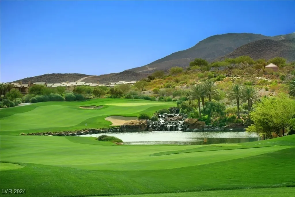 The fairway overlooking the water hazard and green behind it at DragonRidge Country Club