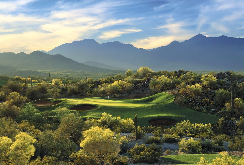 Aerial view of a green and surrounding nature of Golf Club of Estrella in Goodyear, Arizona